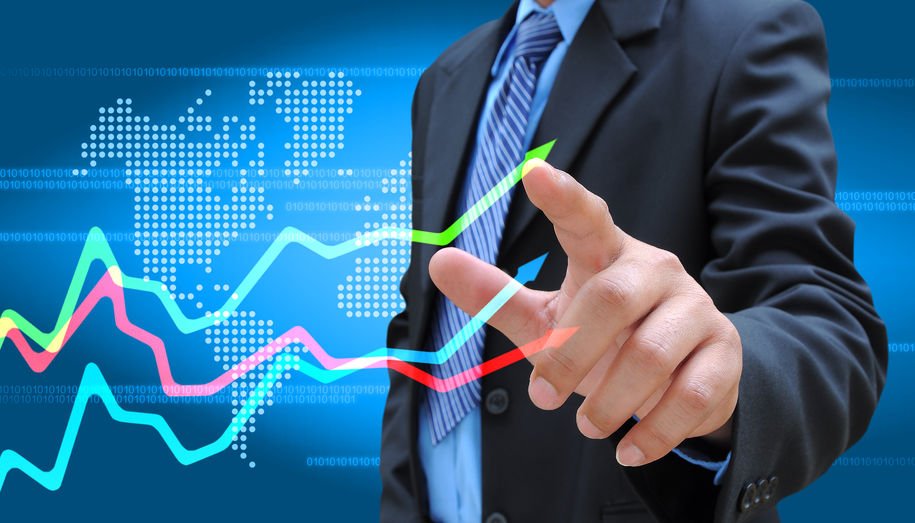 23129075 - businessman hand pushing a business graph